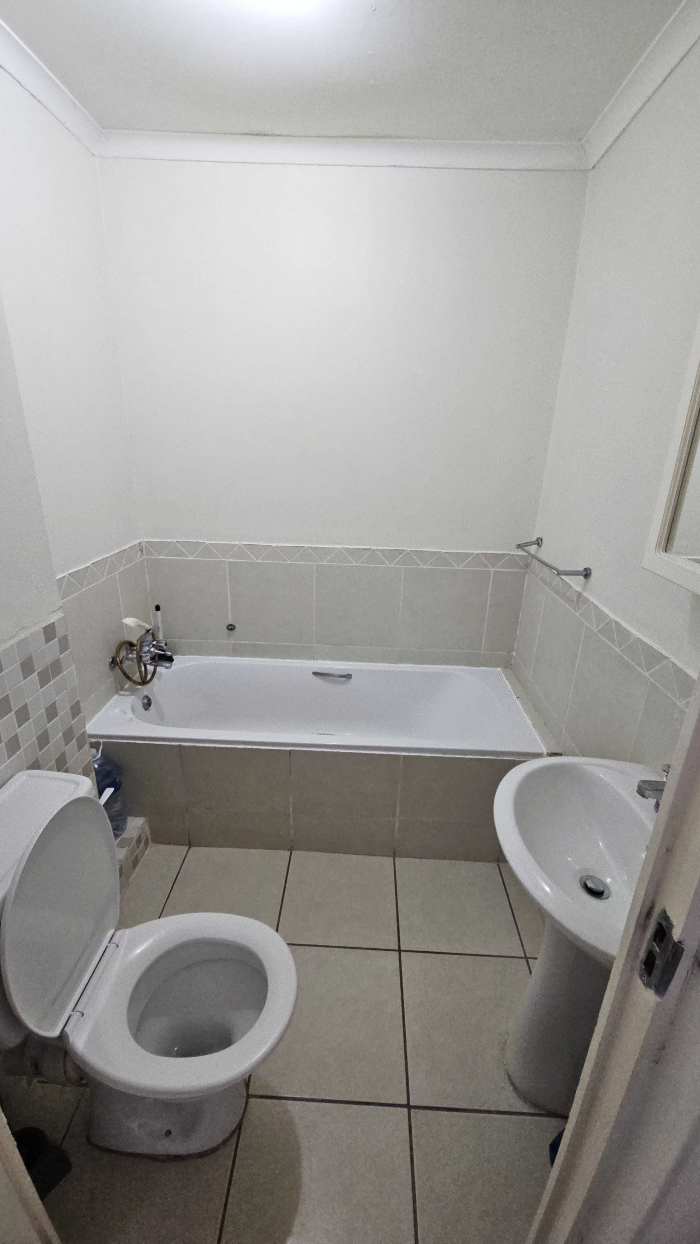 Bathroom with bathtub, toilet and sink